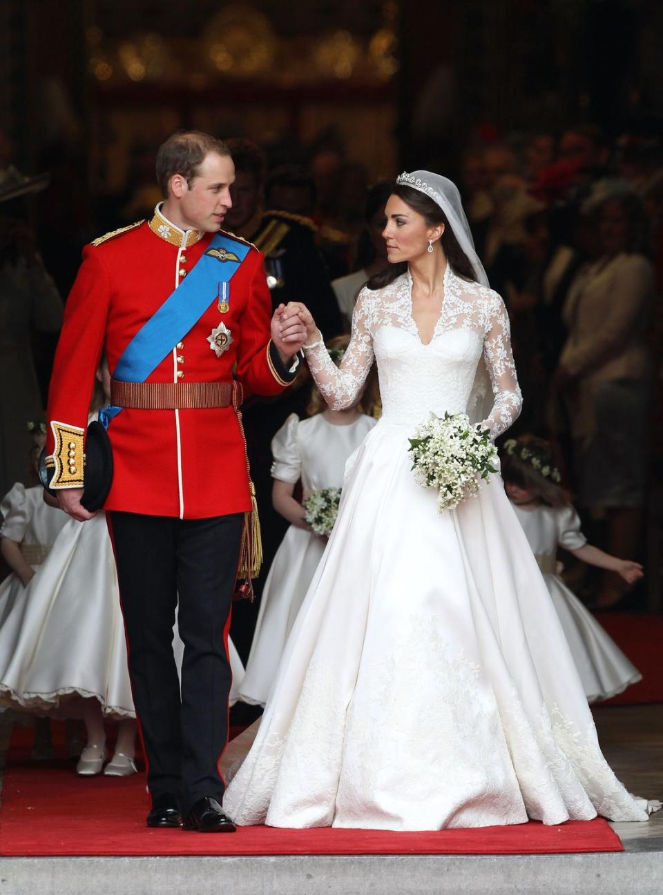 <p>For Prince William and Kate Middleton's massive wedding at Westminster Abbey, Kate pulled out all of the stops for her dress. Her Alexander McQueen gown featured 58 gazar and organza covered buttons down the back and she borrowed the <a href="https://www.townandcountrymag.com/the-scene/weddings/g17805394/royal-wedding-tiaras-throughout-history/" rel="nofollow noopener" target="_blank" data-ylk="slk:Queen's Cartier Halo;elm:context_link;itc:0;sec:content-canvas" class="link ">Queen's Cartier Halo</a>, which was given to Queen Elizabeth by the Queen Mother on her 18th birthday.</p>