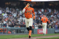 San Francisco Giants' Thairo Estrada celebrates as he nears the plate on a home run against the Cincinnati Reds during the first inning of a baseball game in San Francisco, Friday, May 10, 2024. (AP Photo/Jeff Chiu)