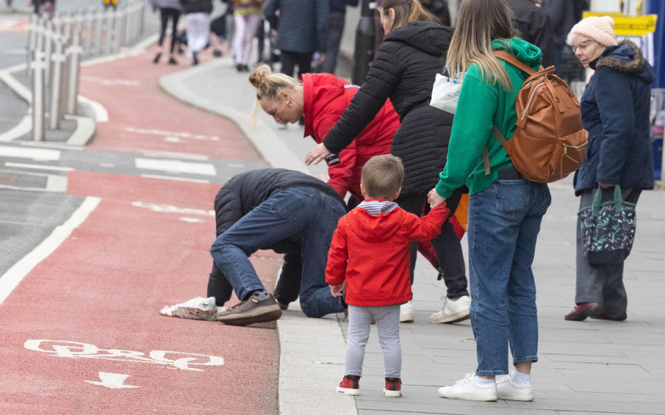 Pedestrian Dave Dawson fell in front of a photographer while crossing. (Reach)