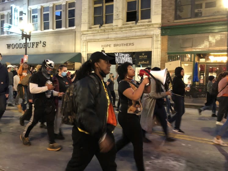 KNOXVILLE, TENNESSEE APRIL 22, 2021 -- Constance Every and a student of Austin-East Magnet High School protest the police shooting of Anthony J. Thompson Jr. (Jenny Jarvie / Los Angeles Times)