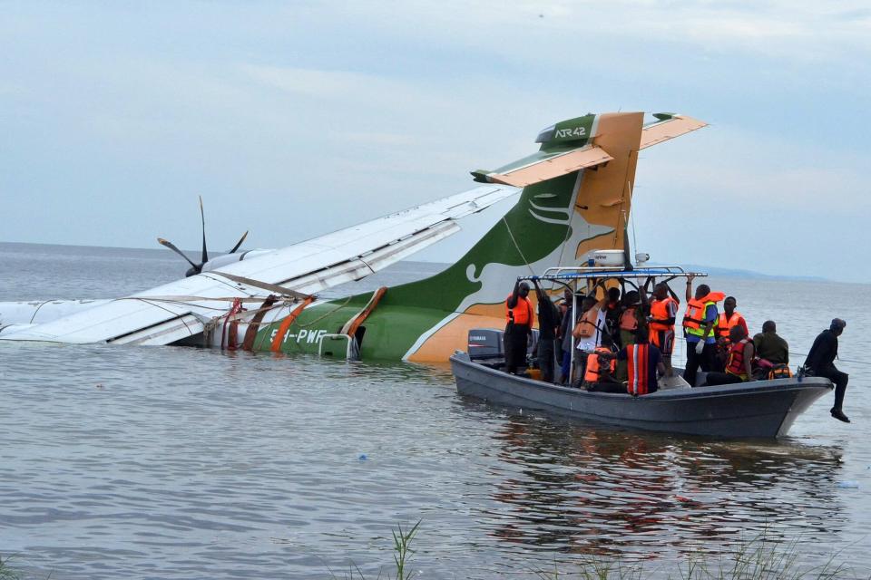 Rescuers search for survivors after a Precision Air flight that was carrying 43 people plunged into Lake Victoria as it attempted to land in the lakeside town of Bukoba, Tanzania on November 6, 2022. - Three people died when a plane carrying dozens of passengers plunged into Lake Victoria in Tanzania on November 6, 2022, as it approached the northwestern city of Bukoba, the fire and rescue service said. Rescuers have pulled 26 survivors to safety after the Precision Air plane crashed due to bad weather, with 43 people, including 39 passengers, aboard flight PW 494 from the financial capital Dar es Salaam to the lakeside city, according to regional authorities.