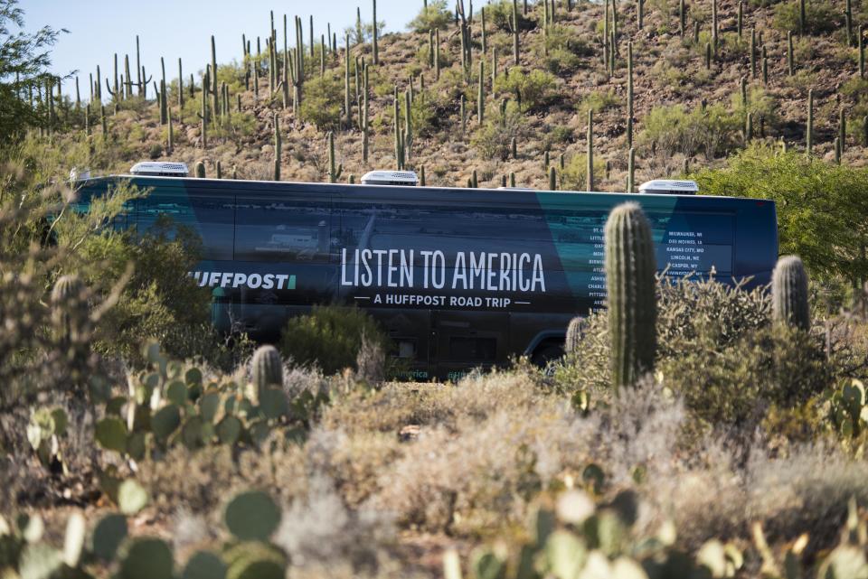 The HuffPost bus sits&nbsp;amid cacti on the outskirts of Tucson.