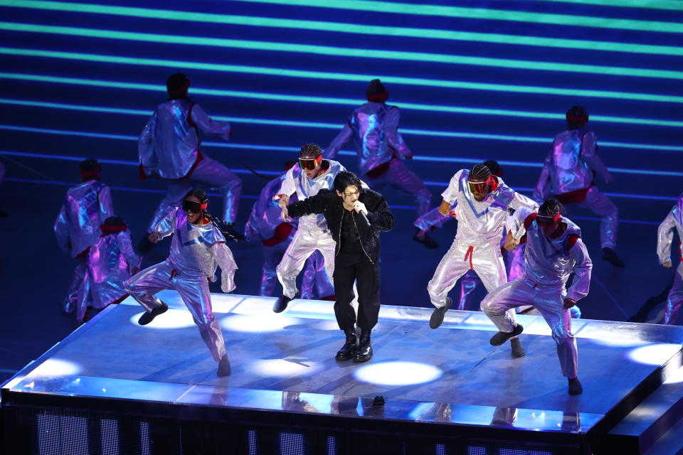 AL KHOR, QATAR - NOVEMBER 20: South Korean band BTS performs during the official opening ceremony of FIFA World Cup Qatar 2022 ahead of the opening match between Qatar and Ecuador at Al Bayt Stadium, in Al Khor, north of Doha, Qatar on November 20, 2022. (Photo by Evrim Aydin/Anadolu Agency via Getty Images)