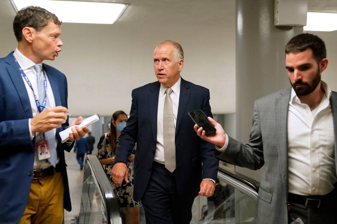 Sen. Thom Tillis, R-N.C., center, speaks with reporters on Capitol Hill in Washington on June 9, 2022. Tillis was among a group of four Republican and Democratic senators who hammered out a bipartisan agreement on gun reform after two weeks of closed-door talks.