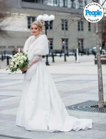 <p>Kathy Thomas Photography</p> Lauren Alaina poses in her wedding dress