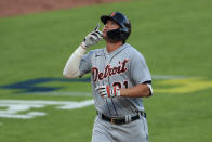 Detroit Tigers' JaCoby Jones reacts after hitting a two-run home run in the ninth inning during a baseball game against the Cincinnati Reds at Great American Ballpark in Cincinnati, Saturday, July 25, 2020. (AP Photo/Aaron Doster)