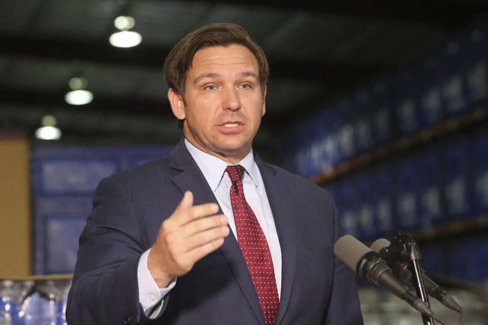 Florida Gov. Ron DeSantis answers questions at a news conference at an emergency management warehouse about the spread of the coronavirus, Friday March 13, 2020 in Tallahassee, Fla. The vast majority of people recover from the new coronavirus. According to the World Health Organization, most people recover in about two to six weeks, depending on the severity of the illness. (AP Photo/Steve Cannon)