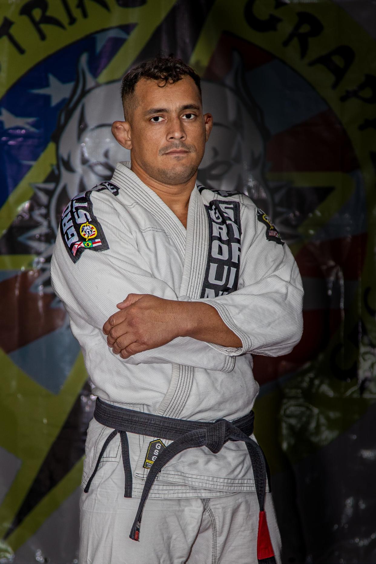 Alabama National Guard Pfc. Elioenai Campos poses for a photo wearing his dojo’s official gi in Columbiana, Alabama, June 10, 2022. Campos is part of the United States national jiu-jitsu team set to compete for international honors at the World Games in Birmingham.