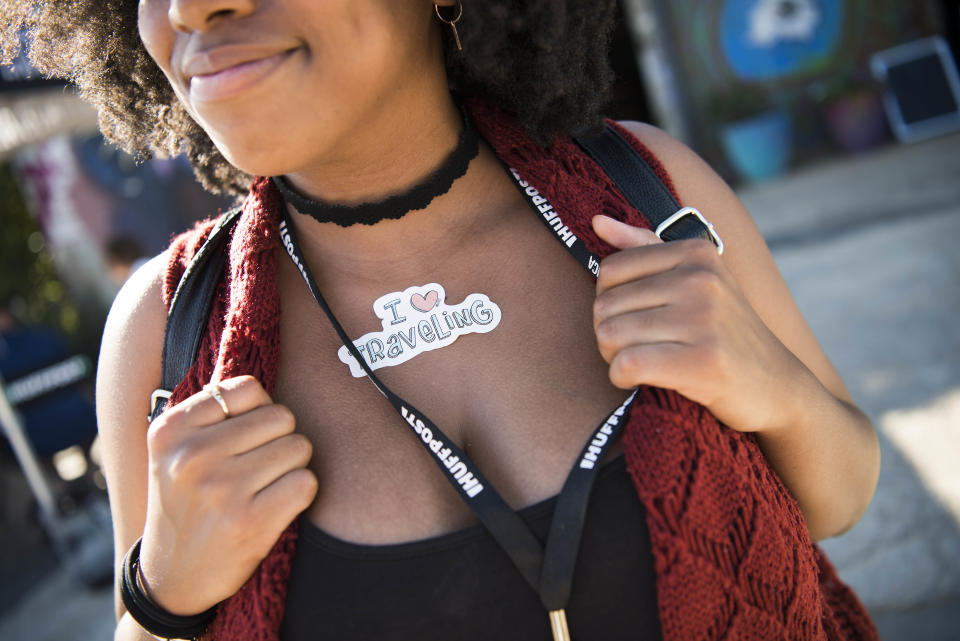 Jolie Doggett shows off a sticker during the HuffPost visit to IX Art Park.