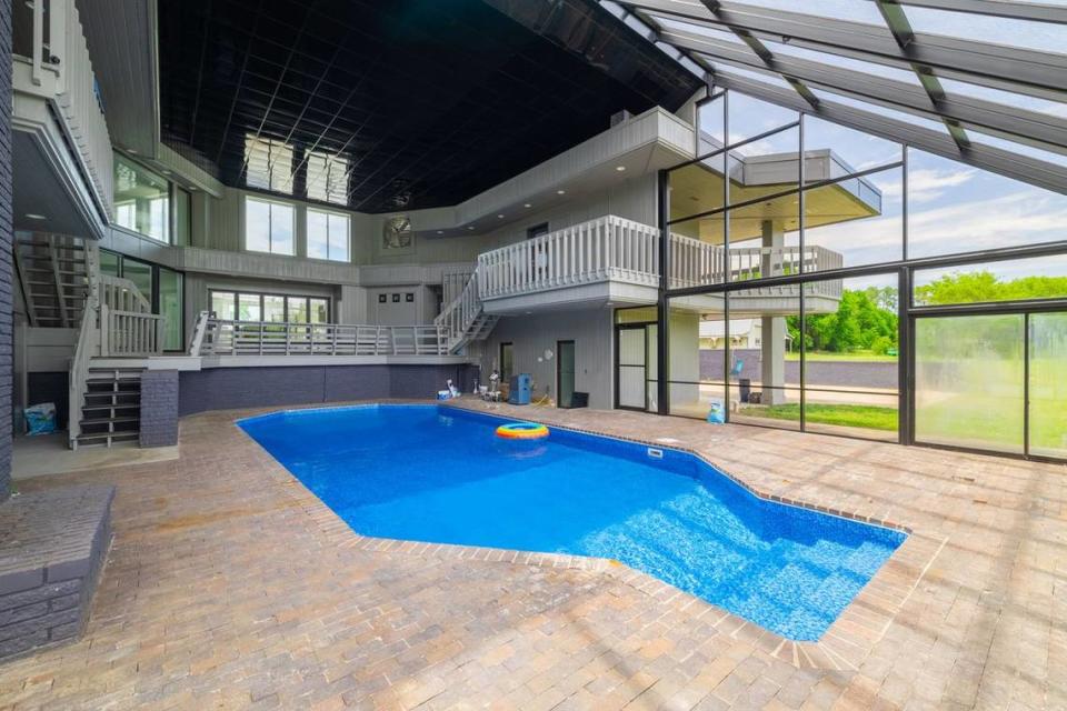 At this Kechi house going up for auction next month, there’s an indoor saltwater pool just off the kitchen.