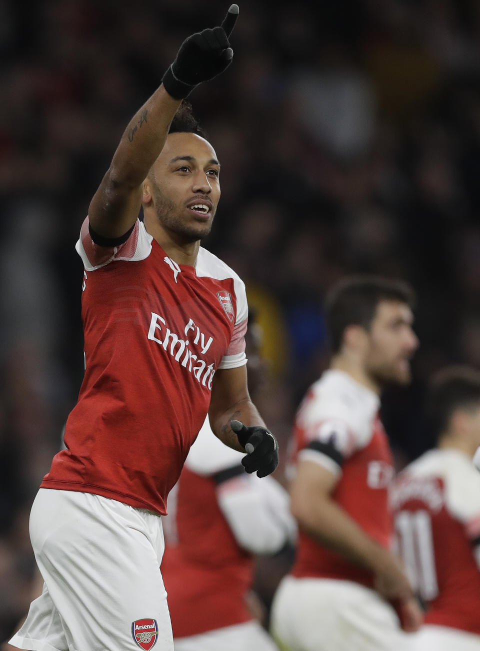 Arsenal's Pierre-Emerick Aubameyang celebrates after scoring his side's fourth goal during the English Premier League soccer match between Arsenal and Fulham at Emirates stadium in London, Tuesday, Jan. 1, 2019. (AP Photo/Kirsty Wigglesworth)