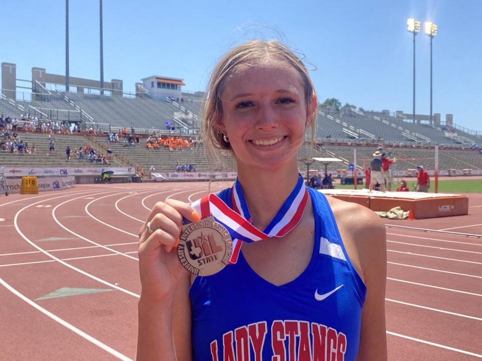 Claude junior Andi Holland poses with her 1A girls high jump silver medal.