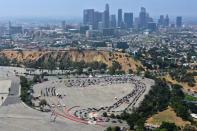 Cars line up at a drive-through coronavirus disease (COVID-19) testing site at Dodger Stadium in Los Angeles