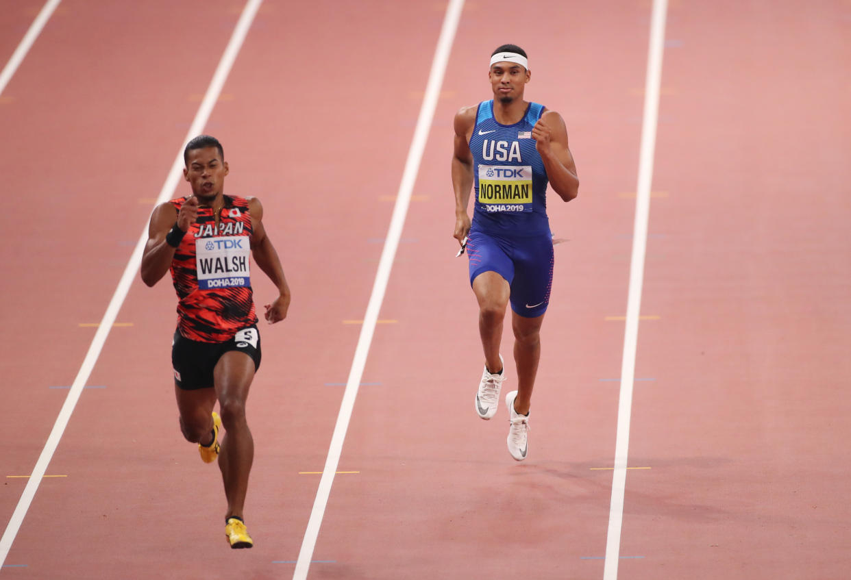 American sprinter Michael Norman, right, jogged to the finish in his 400 meter semifinal heat on Wednesday. He will not be in the event final. (Getty Images)