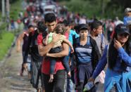 <p>A caravan of more than 1,500 Honduran migrants moves north after crossing the border from Honduras into Guatemala on Oct. 15, 2018 in Esquipulas, Guatemala. (Photo: John Moore/Getty Images) </p>