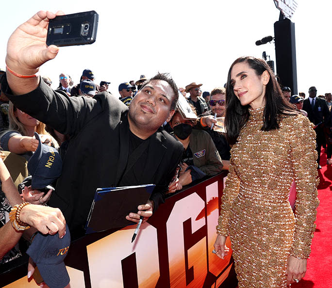 Jennifer Connelly signs autographs for fans at the premiere of ‘Top Gun: Maverick’ held at USS Midway on May 4th, 2022 in San Diego, California. - Credit: Christopher Polk for Variety