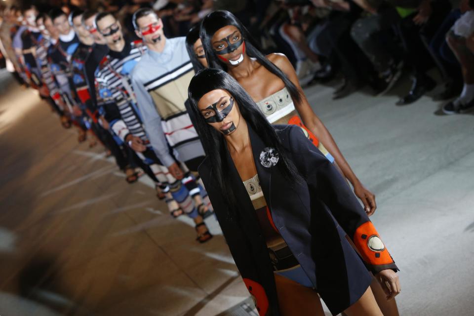 Models present creations as part of the Givenchy men's fashion Spring-Summer 2014 collection, presented Friday, June 28, 2013 in Paris. (AP Photo/Francois Mori)