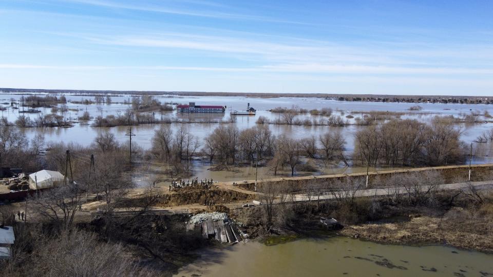 An aerial view of a dam and a flooded area in Ishim, Tyumen region, 1968 km (1230 miles) east of Moscow, Russia, on Monday, April 22, 2024. The situation with floods in Russia's Tyumen Region remains tense, with the level of water in the Ishim River having exceeded 10.5 meters. (AP Photo/Sergei Rusanov)