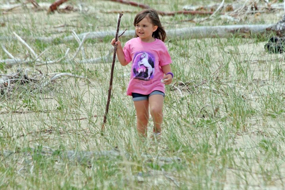 Emmersyn Murray explores the beaches of Lake Superior during a family camping trip in 2018.