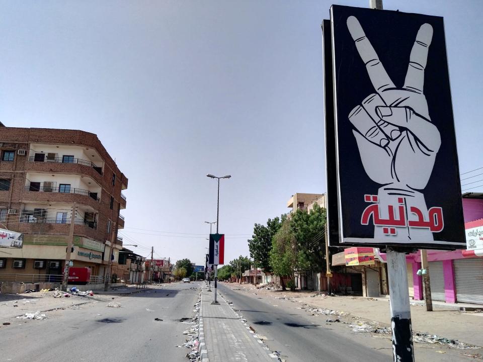 The U.S. has been slow to involve itself in the crisis, while other nations attempt to broker peace. A placard on Street 60 in a&nbsp;nearly deserted Khartoum on June 6&nbsp; reads: "Civilian and peaceful." (Photo: - /AFP/Getty Images)