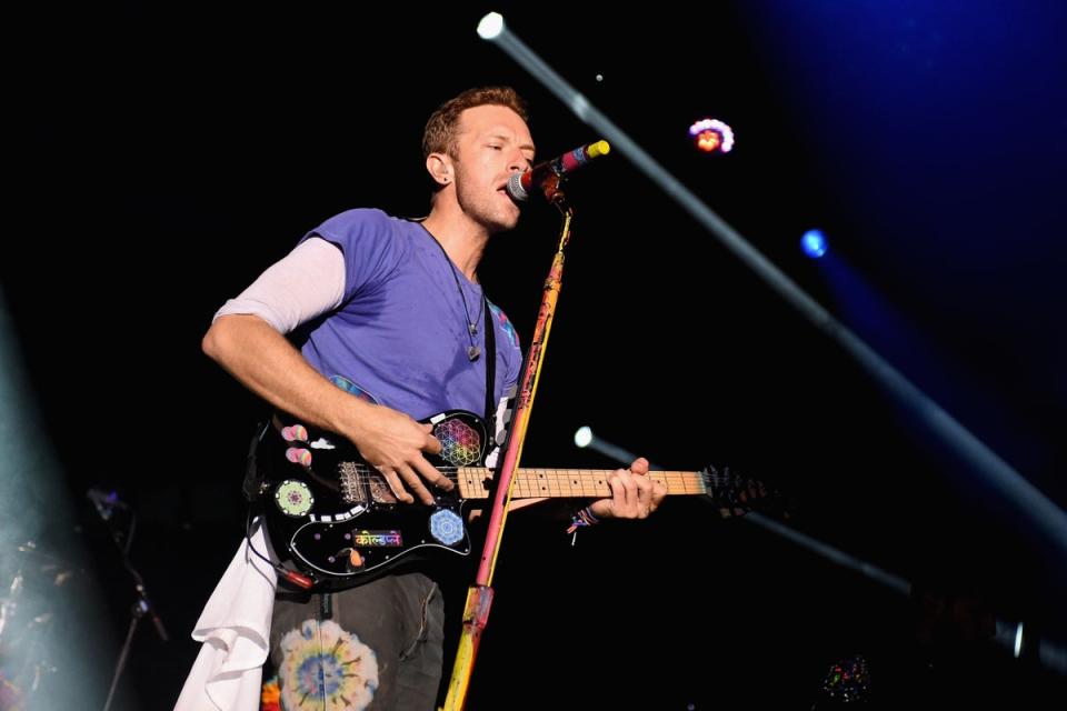 Martin  performed a new song using the color orange to avoid upsetting Luton fans at the festival (PA Media)