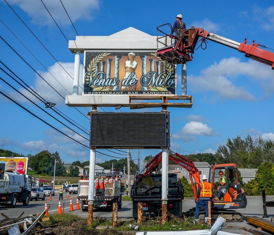 A crew was on site Wednesday restoring the sign outside of the Venus de Milo on Route 6 in Swansea.