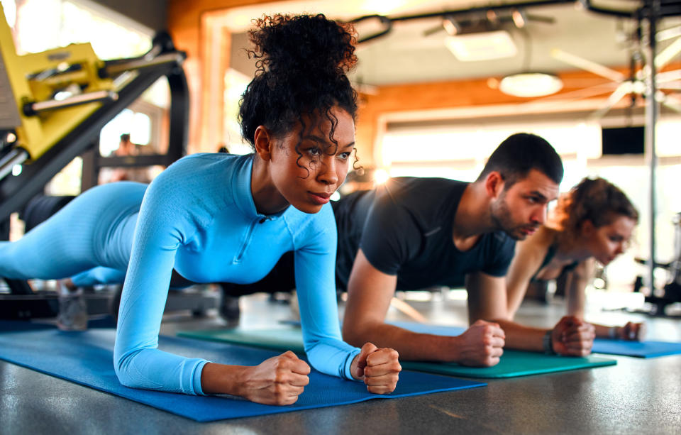 People doing yoga at the gym