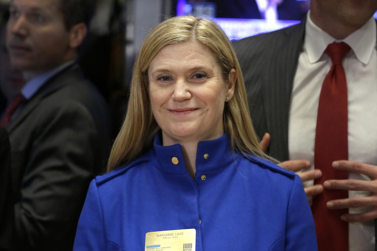 J.P. Morgan CFO Marianne Lake visits the trading floor after ringing the New York Stock Exchange opening bell, Wednesday, Feb. 24, 2016.  (AP Photo/Richard Drew)