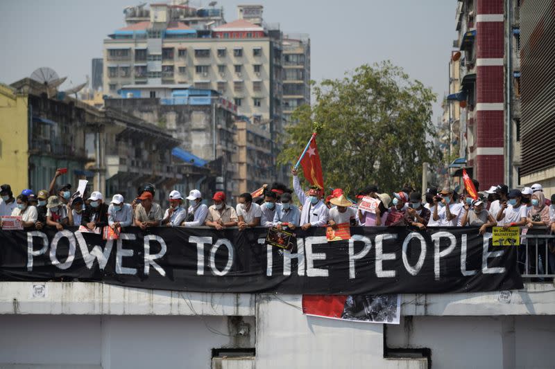 Demonstrators protest a against military coup in Yangon