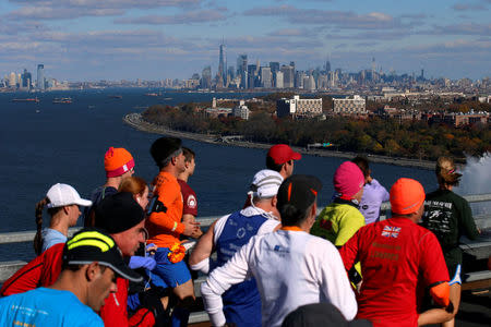 Manhattan is seen in the distance as runners cross the Verrazano–Narrows Bridge during the 2016 New York City Marathon in the Manhattan borough of New York City, NY, U.S. November 6, 2016. REUTERS/Brendan McDermid