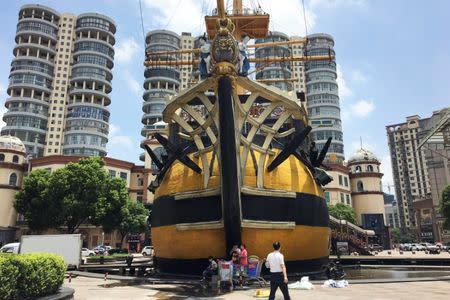 A closed ship-shaped restaurant is seen at a commercial district in Bengbu, Anhui province, China July 10, 2017. REUTERS/Yawen Chen