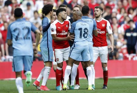 Britain Football Soccer - Arsenal v Manchester City - FA Cup Semi Final - Wembley Stadium - 23/4/17 Arsenal's Alex Oxlade-Chamberlain and Manchester City's Fabian Delph clash Action Images via Reuters / Carl Recine Livepic