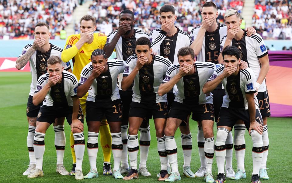 German players cover their mouths in protest during the World Cup in Qatar - Alex Livesey/Danehouse/Getty Images