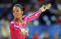 <p>Douglas performs the floor exercise in the Artistic Gymnastics Women’s Individual All-Around final at the 2012 London Games. (Ronald Martinez/Getty Images) </p>