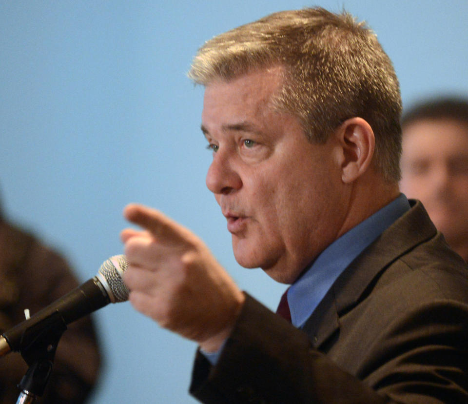 Illinois Treasurer Dan Rutherford speaks during a news conference on Monday, Feb. 10, 2014, in Schaumburg, Ill. Rutherford says a former employee's allegations of sexual harassment and political coercion are false. (AP Photo/Daily Herald, Patrick Kunzer)