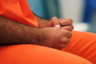 Immigration detainee Alexander Martinez gesticulates as he speaks during an interview with The Associated Press inside the Winn Correctional Center in Winnfield, La., Friday, July 30, 2021. (AP Photo/Gerald Herbert)