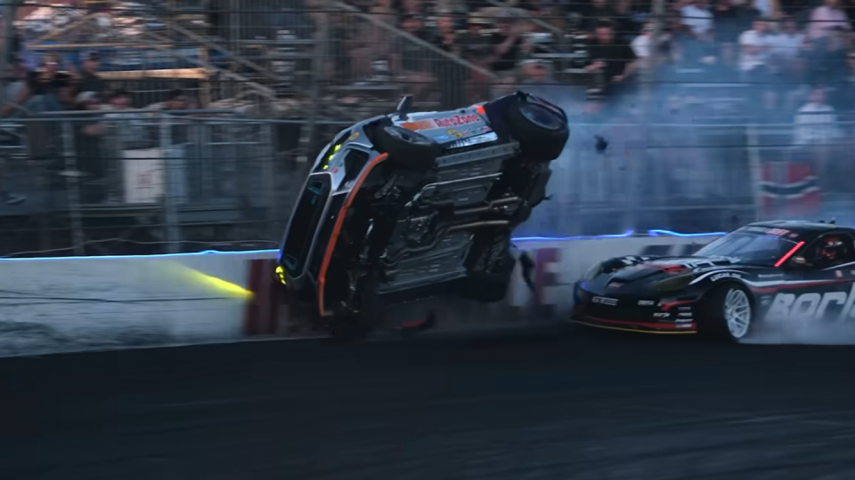 a race car crashing into another race car