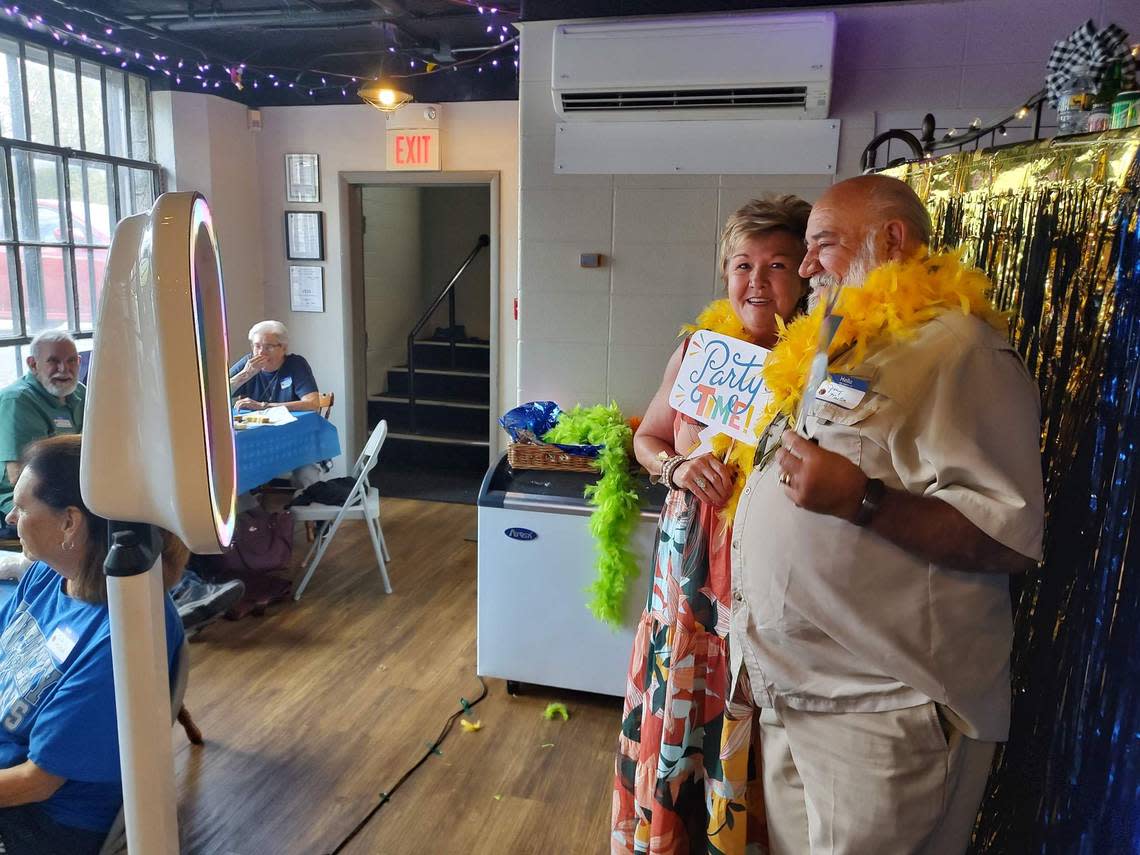 Class members from the 1950s and 1960s gathered at the Athens Schoolhouse for a reunion Saturday. Connie and Jerry Martin posed for a photo at the photo booth. Karla Ward/kward1@herald-leader.com