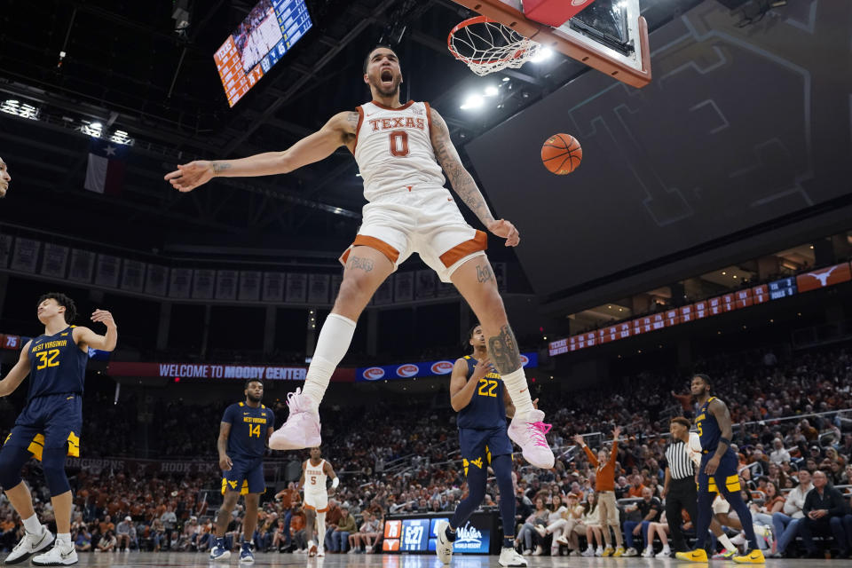 Texas forward Timmy Allen (0) celebrates as he scores against West Virginia during the second half of an NCAA college basketball game in Austin, Texas, Saturday, Feb. 11, 2023. (AP Photo/Eric Gay)