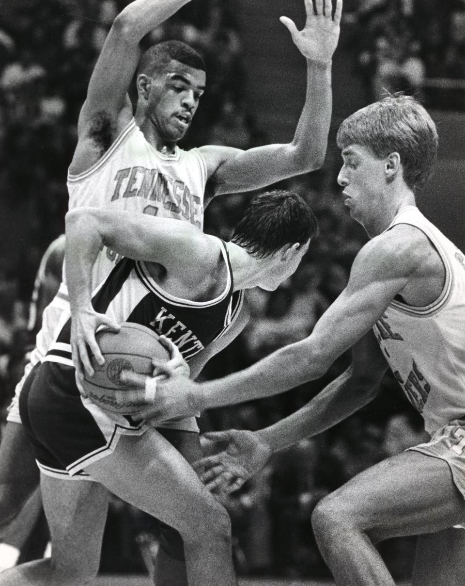 Tennessee's Clarence Swearengen and Mark Griffin defend Kentucky's Jean Sutton in a January 1989 game.