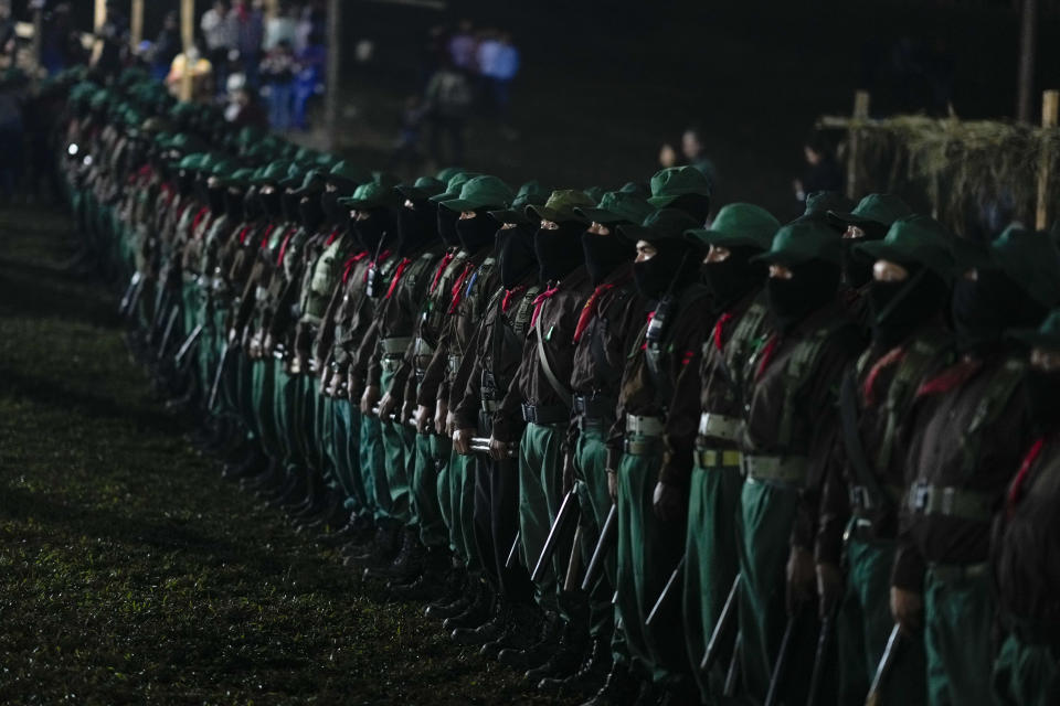 Members of the Zapatista National Liberation Army, EZLN, attend an event marking the 30th anniversary of the Zapatista uprising in Dolores Hidalgo, Chiapas, Mexico, Dec. 31, 2023. (AP Photo/Eduardo Verdugo)