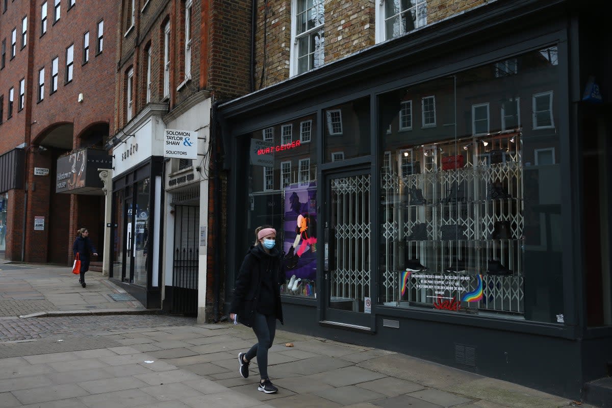  A pedestrian walks past a closed shop on Hampstead High Street on February 28, 2021 in London, (Getty Images)