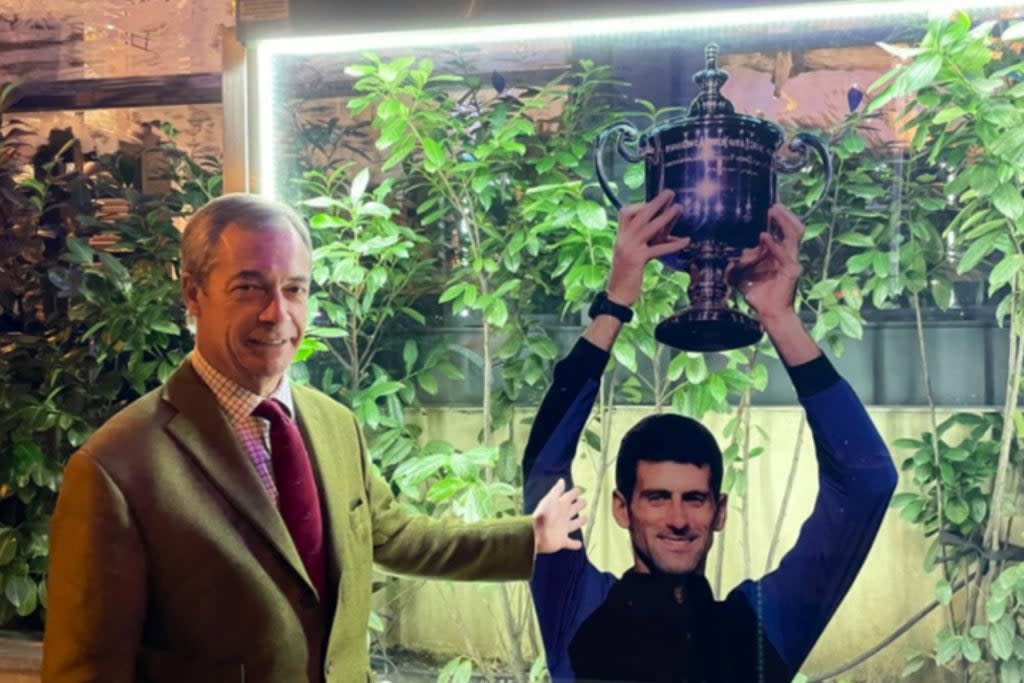 Farage with a cut out of Novak Djokovic  (Twitter)