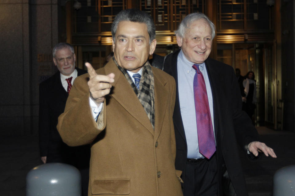 FILE- In this Jan. 5, 2012 file photo, former Goldman Sachs board member Rajat Gupta, left, exits Manhattan federal court with his attorney Gary Naftalis, in New York. The insider trading trial of the former board member for Goldman Sachs and Procter & Gamble begins in New York on Monday, May 21, 2012, with jury selection. (AP Photo/Mary Altaffer, File)