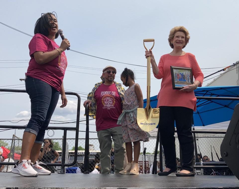 U.S. Sen. Debbie Stabenow (right) holds a gold shovel used in the 2019 groundbreaking of the Motown Museum's $65 million expansion, gifted to her by museum CEO and chairwoman Robin Terry on May 21, 2023.