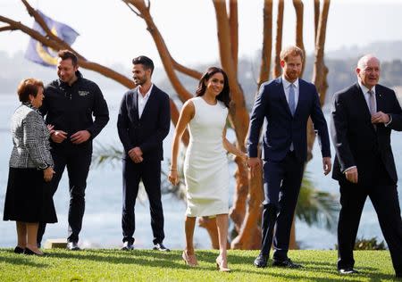 Britain's Prince Harry and wife Meghan, Duchess of Sussex walk with Australia's Governor General Peter Cosgrove and his wife Lynne Cosgrove at Admiralty House during their visit in Sydney, Australia October 16, 2018. REUTERS/Phil Noble/Pool