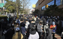 FILE - In this Feb. 24, 2020 file photo, People line up to buy face masks at a store in Daegu, South Korea. As fears of a soaring viral outbreak grip the southeastern South Korean city of Daegu and nearby areas, many residents are struggling as they try to avoid the new virus. (Lee Moo-ryul/Newsis via AP, File)