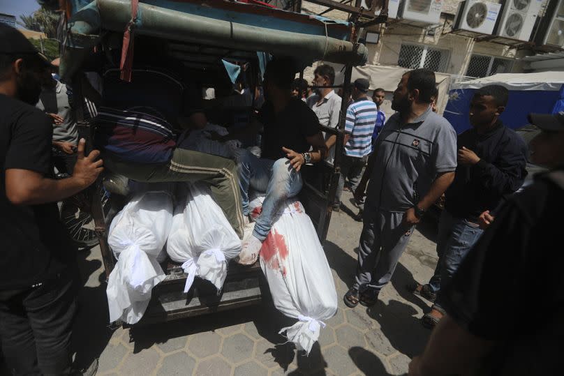 Palestinians killed in the Israeli bombardment of the Gaza Strip are brought to al-Aqsa Hospital in Deir al-Balah, central Gaza Strip, Saturday, June 8, 2024