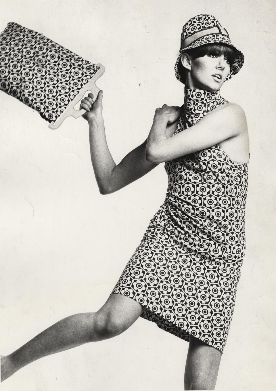 878324 Floral print shift dress and matching tote bag and hat by Biba, 1966 (b/w photo) by Atherton, Peter (fl.1966); Fashion Museum Bath; © Fashion Museum Bath.

Please note: The artwork in this photograph is in copyright. It is your responsibility to ensure this additional copyright is cleared prior to use. Please contact Bridgeman Images if you require further assistance; however, please be advised that Bridgeman does not currently hold contact information for the copyright handler of this artwork.