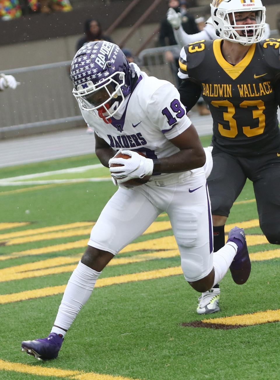 Mount Union's Jaden Manley pulls in a first-quarter touchdown catch during action at Baldwin Wallace Saturday, November 12, 2022.